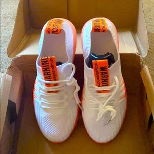 white and orange sneakers